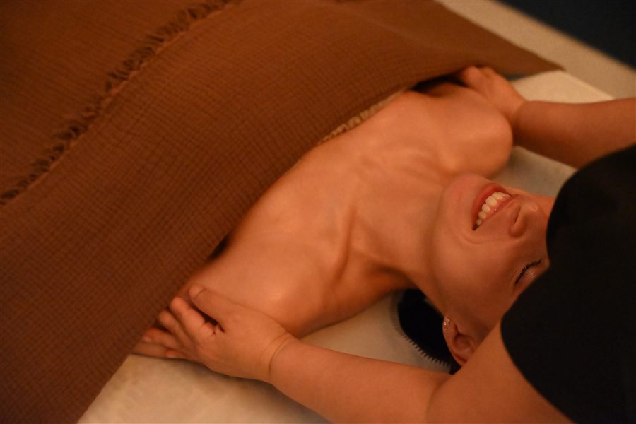 Hands-on aroma therapy across the shoulders